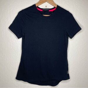 Pearl Izumi Woman’s M Scape Top Black Tee Bioviz Lower Rear Hem Angled Shoulder